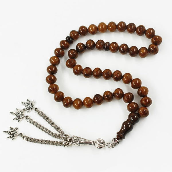 Antique musky sandalous rosary in a distinctive Beautiful olive color, a small bead woven with durable propylene thread and a tassel made of a mixture of antimony and metal.