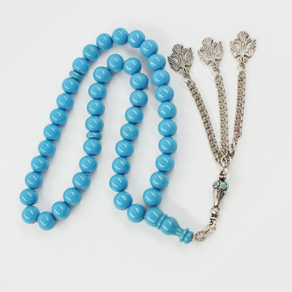 Antique musky sandalous rosary in a attractive sky blue color, a small bead woven with durable propylene thread and a tassel made of a mixture of antimony and metal.